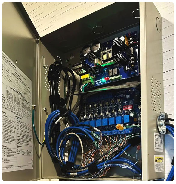 Access control panel with wiring and circuit boards, showcasing advanced security technology for gates and doors.