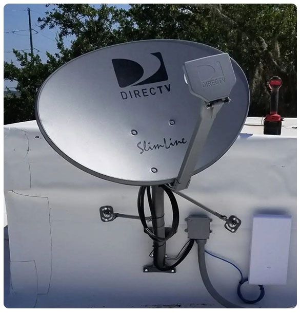DirecTV Slimline satellite dish installed on roof, supporting premium TV service for Hotel Simone, St. Simons Island, GA.