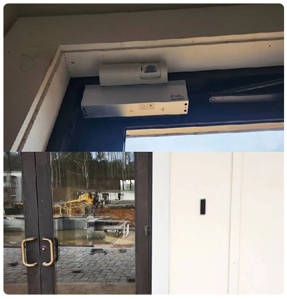 Access control system installation at entry point, featuring security hardware above and beside double doors, ensuring safety and surveillance at Pointe Grand Apartments.