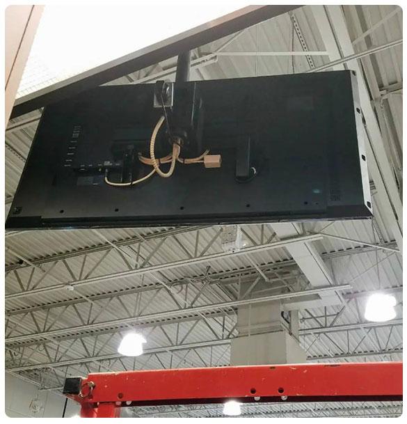 Installation of digital signage monitor in retail environment, showcasing advanced technology solutions by SAV Systems for Dick's Sporting Goods project.