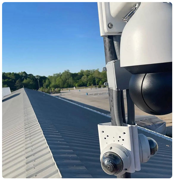 CCTV camera system installed on rooftop overlooking La Vaquita Flea Market in Pendergrass, GA, enhancing security for commercial space.